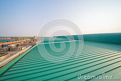 Empty space of metal sheet corrugated roof on rooftop of industry factory. Steel structure of modern station building roof. Metal Stock Photo