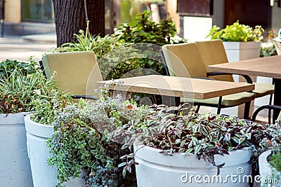 Empty square tables of an outdoor cafe. Stock Photo