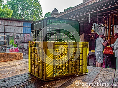 Empty stacks of colorful plastic crates in a farmers produce market Editorial Stock Photo