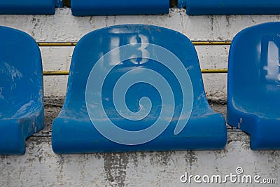 Empty stadium seats with number 13 . Baker`s dozen concept . sports superstitions Stock Photo