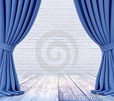 Empty stage with white brick wall and blue curtains with focus on white wood plank floor Stock Photo