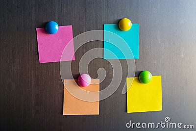 Empty stickers for notes on the refrigerator attached with magnets Stock Photo