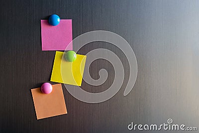 Empty stickers for notes on the refrigerator attached with magnets Stock Photo