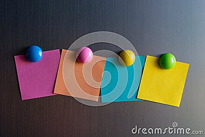 Empty stickers for notes on the refrigerator attached with magnets Stock Photo