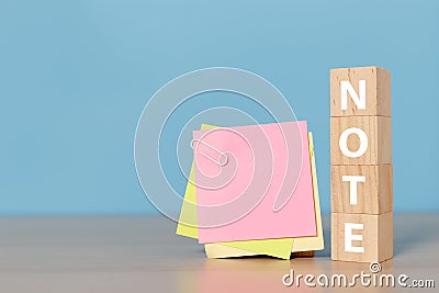 Empty sticky post note paper with wooden cube block. Used for entering text. notepaper memory remember notice Stock Photo