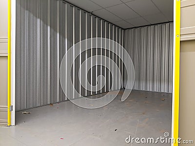 An empty self storage unit room Stock Photo