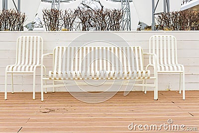 Empty street bench and chairs. Relax zone in the city Stock Photo