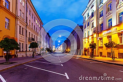 Empty street illuminated with yellow lights, Minsk city Editorial Stock Photo