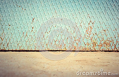 Empty street metal weathered wall with ground floor Stock Photo