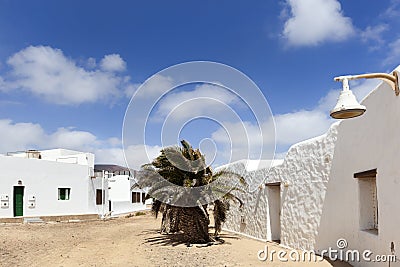 Empty street with sand and white houses in Caleta de Sebo on the island La Graciosa Stock Photo