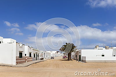 Empty street with sand and white houses in Caleta de Sebo on the island La Graciosa Stock Photo