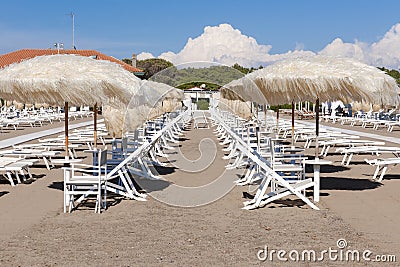 Empty sunbeds on the beach Stock Photo