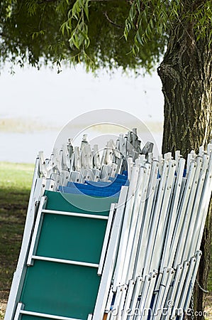 Empty sunbeds in line at the lake Stock Photo