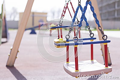 empty swings and carousels at the playground. Stock Photo