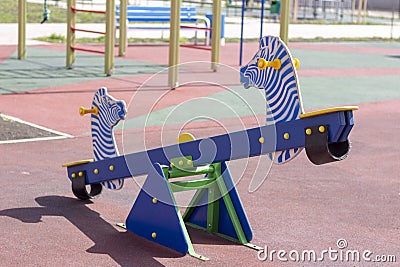 empty swings and carousels at the playground. Stock Photo