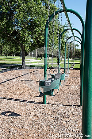 Empty swings in a playground Stock Photo