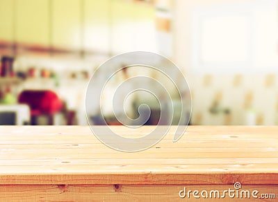 Empty table board and defocused retro kitchen background. Stock Photo