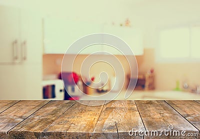 Empty table board and defocused white retro kitchen background Stock Photo