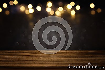 Empty table in front of black and gold glitter lights background Stock Photo