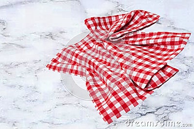 Empty table product. Top view of a abstract blurred marble top with a red and white checkered tablecloth or napkin. Template for Stock Photo