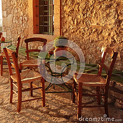 Empty table at an street village restaurant, Crete, Greece Stock Photo