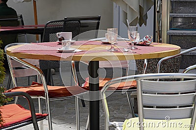 Empty table in a terrace cafÃ© with cups and glasses on it. Stock Photo