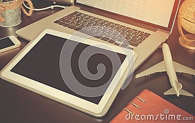 Empty tablet on business travel working desk Stock Photo