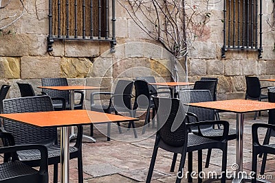 Empty terrace tables in the medieval atmosphere Stock Photo