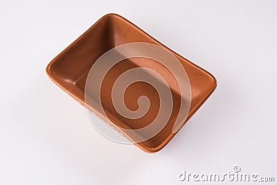 Empty terracotta serving bowl or brown clay soup bowl isolated on white Stock Photo