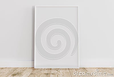 Empty thin white frame on light wooden floor with white wall behind it Stock Photo