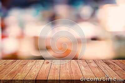 Wood table with blurred interior in cafe background. Stock Photo