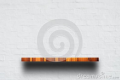 Empty top of wooden shelf with white brick wall. Stock Photo