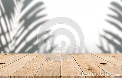 Empty top wooden table with blurred tree shadow on concrete wall background Stock Photo