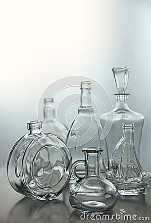 Empty transparent glass bottles forms Stock Photo