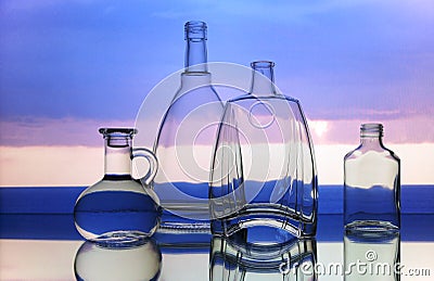 Empty transparent glass bottles forms Stock Photo