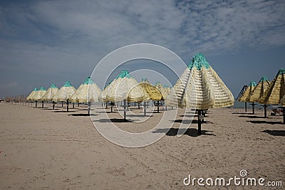 Empty umbrellas on the beach of pescara Stock Photo