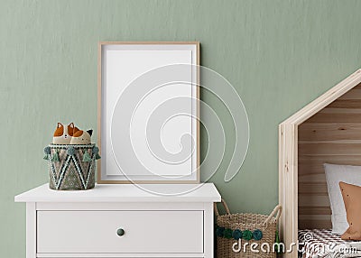 Empty vertical picture frame on green wall in modern child room. Mock up interior in scandinavian style. Free, copy Stock Photo