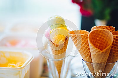 Empty waffle cone in glass for ice cream. Stock Photo