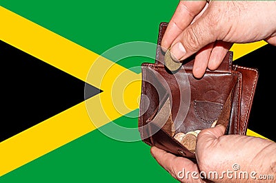 Empty wallet shows the global financial economic crisis triggered by the corona virus in Jamaica Stock Photo