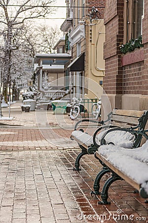 Empty, Wet, Snowy, Dreary Winter street in small town Stock Photo