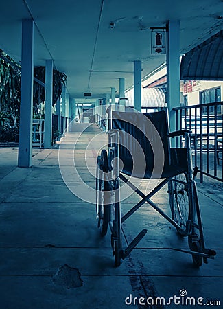 Empty wheelchair and hospital background, feels lonely and quiet. Stock Photo