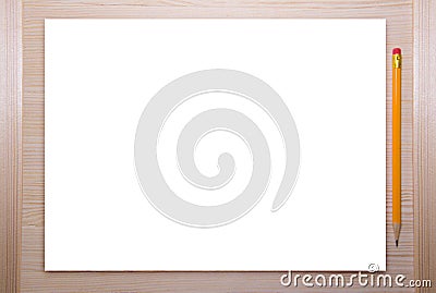 Empty white canvas frame with pencil on a wooden background. Stock Photo