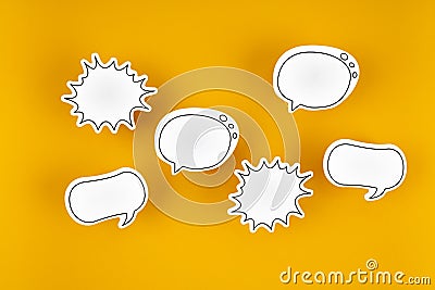 Empty white chat bubbles over yellow background Stock Photo