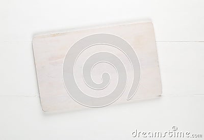 Empty white cutting board on white wooden table background top view from above Stock Photo