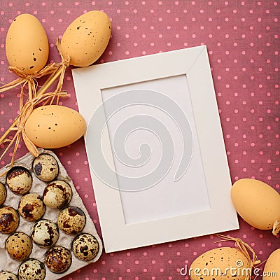 Empty white frame with Easter eggs Stock Photo