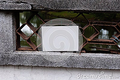 An empty white laminated sign attached to a bridge Stock Photo