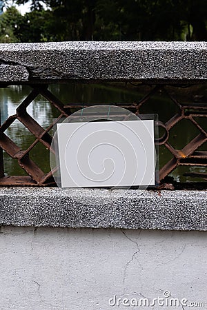 An empty white laminated sign attached to a bridge Stock Photo