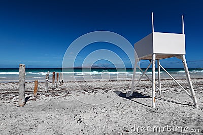 Empty white lifeguard post facing the sea Stock Photo