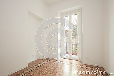 Empty, white living room with large window in a renovated apartment Stock Photo