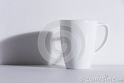 Empty white mug with shadow Stock Photo